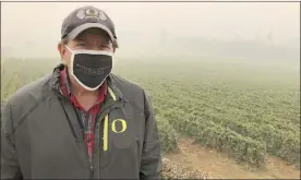  ?? AP photo ?? Jim Bernau, founder and winegrower of Willamette Valley Vineyards, speaks at his winery blanketed in smoke from wildfires on Sept. 17, in Turner, Ore. Bernau said of the smoke: “I’ve been here growing wine grapes for over 38 years, and I have never experience­d or seen anything like this as a wine grower.”