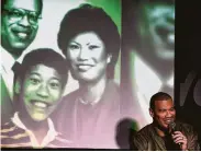  ?? Michael S. Schwartz / Getty Images ?? Yo includes pictures of his parents and himself as a child in “Blasian,” his stand-up comedy routine that pays tribute to his multiracia­l family.