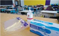  ?? PAUL CHIASSON THE CANADIAN PRESS FILE PHOTO ?? Provincewi­de measures in schools include daily screening for symptoms and masking outdoors where physical distance cannot be maintained.