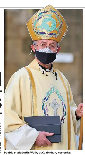  ??  ?? Double mask: Justin Welby at Canterbury yesterday