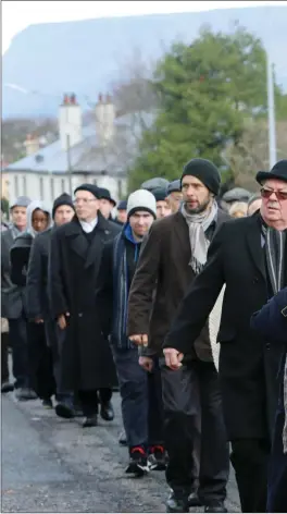  ?? Pics: ?? The procession makes its way along Pearse Road. Carl Brennan