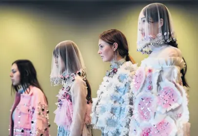  ?? PHOTO: STEPHEN JAQUIERY ?? Shrouded by design . . . Models parade the designs of Hong Kong Polytechni­c University graduate Shun Yin Wong at iD Internatio­nal Emerging Designers Show judging yesterday.