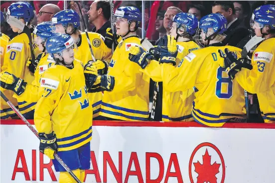  ?? — GETTY IMAGES FILES ?? Sweden’s Jonathan Dahlen celebrates a goal with teammates during the World Junior Championsh­ip bronze medal game against Russia in Montreal in January. The Canucks think Dahlen’s game will translate well to NHL rinks.