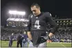  ?? JOSE CARLOS FAJARDO — STAFF ?? Raiders QB Derek Carr stands on the field after losing 20-17to the Cowboys on Sunday. Carr had a key fumble late in the game.