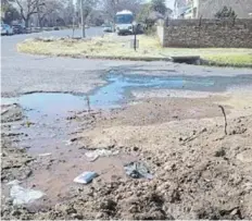  ??  ?? A water leak in Griffiths Street which, residents say, WET MESS: has been running since early last year