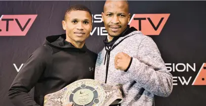  ?? Picture: Brian Wysoke ?? GOING PLACES. Former IBO super-bantamweig­ht champion Ludumo Lamati (left) alongside Mashudu Oscar Nembahe of BRD Promotions with the WBC Southern Africa ‘Ubuntu’ trophy belt.