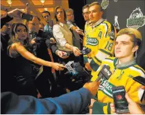  ??  ?? From left, Humboldt Broncos Tyler Smith, Kaleb Dahlgren and Ryan Straschnit­zki take on the media at the Encore on Tuesday.