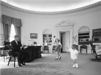  ??  ?? Kennedy with his daughter Caroline and son John in the Oval Office in the White House in October 1962