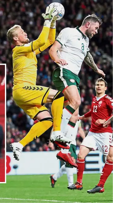  ?? — Reuters ?? Good catch: Denmark goalkeeper Kasper Schmeichel gets to the ball before Ireland’s Daryl Murphy in the 2018 World Cup playoff first leg in Copenhagen on Saturday. Inset: Denmark’s Christian Eriksen reacting after the match.