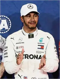  ??  ?? Super fast: Mercedes’ Lewis Hamilton claimed pole position and also set a new lap record in Saturday’s qualifying session for the Abu Dhabi Grand Prix. — Reuters