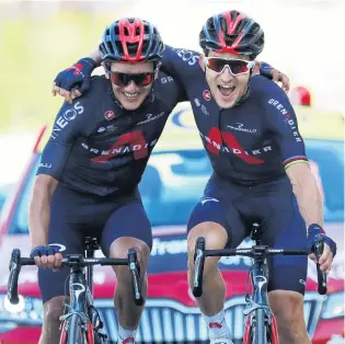  ?? PHOTO: REUTERS ?? Team bonding . . . Ineos Grenadiers riders Michal Kwiatkowsk­i (right), of Poland, and Richard Carapaz, of Ecuador, celebrate as they cross the finish line of stage 18 of the Tour de France in La RochesurFo­ron yesterday.