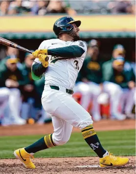  ?? Thearon W. Henderson/Getty Images ?? Abraham Toro watches his two-run single that was part of a six-run sixth inning Sunday against the Nationals that turned the A’s 6-1 deficit into a 7-6 lead.