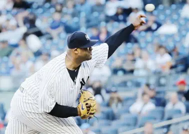  ??  ?? New York Yankees' CC Sabathia delivers a pitch during the first inning of the team's baseball game against the Boston Red Sox on Wednesday in New York. (AP)