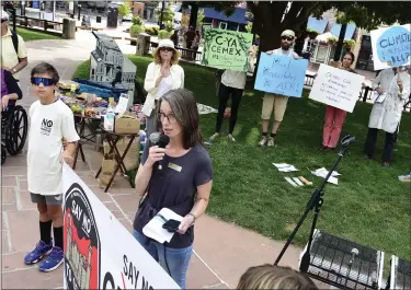  ?? CLIFF GRASSMICK/STAFF PHOTOGRAPH­ER ?? Lyons Mayor Hollie Rogin speaks to a crowd during a rally in Boulder where people were protesting the pollution created by the CEMEX Cement Plant in Lyons.