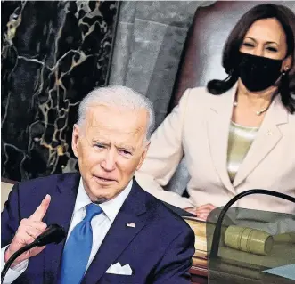  ?? REUTERS ?? U.S. President Joe Biden addresses a joint session of Congress as U.S. Vice-president Kamala Harris looks on at the U.S. Capitol in Washington on April 28.