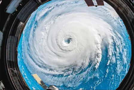  ?? ESA/NASA VIA AP ?? In this Sept. 12 photo provided by NASA, Hurricane Florence churns over the Atlantic Ocean heading for the U.S. East Coast as seen from the Internatio­nal Space Station.