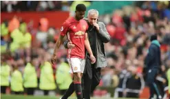  ??  ?? MANCHESTER: Manchester United’s Portuguese manager Jose Mourinho (R) talks with Manchester United’s English striker Marcus Rashford (L) as they leave the pitch at the end of the English Premier League football match between Manchester United and...