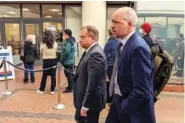  ?? AP PHOTO/MICHAEL LIEDTKE ?? Former Theranos executive Ramesh “Sunny” Balwani, left, walks to federal court Friday with his attorney Mark Davies, right, in San Jose, Calif.