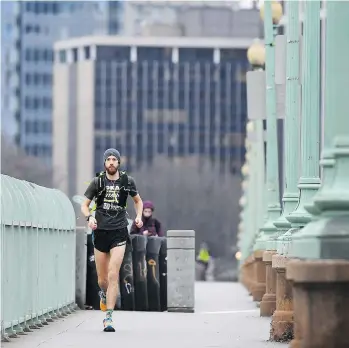  ??  ?? Michael Wardian crosses the Francis Scott Key Bridge while on his way to work in Washington, DC. Wardian is preparing to compete in the World Marathon Challenge, starting Monday in Antarctica.