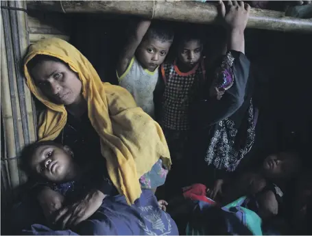  ?? Getty ?? Rohingya refugees wait for food distribute­d by Action Against Hunger in Kutupalong camp, Cox’s Bazar this week