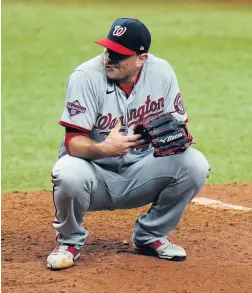  ?? CHRIS O’MEARA/ASSOCIATED PRESS FILE ?? Washington’s Daniel Hudson, a Princess Anne High graduate, was on the mound for the final out of last year’s World Series. He’ll have to watch the playoffs this season.