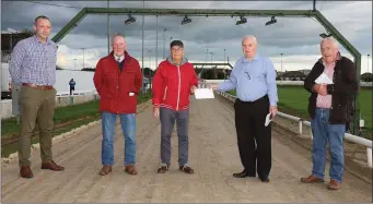  ??  ?? Directors of Enniscorth­y greyhound track making a special presentati­on to Donie Askins, to mark his retirement after 45 years at the venue. From left: tephen Costello (racing manager), James Hendrick, Donie Askins, Paddy Ryan, Shay Hodnett.