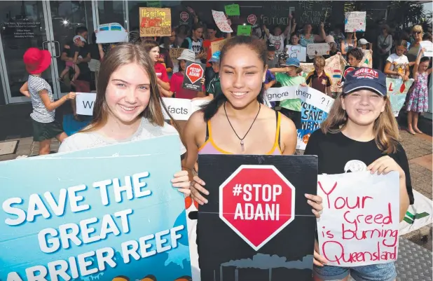  ??  ?? CLASS ACTION: Cairns State High School students Zoe Binions, 15, Jaymie Houtman, 16, and Chloe Gibson, 16, outside MP Warren Entsch's office. Picture: PETER CARRUTHERS