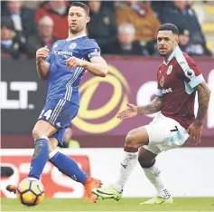  ??  ?? Chelsea’s Gary Cahill (left) in action with Burnley’s Andre Gray during the English Premier League match at Turf Moor in this Feb 12 file photo. — Reuters photo