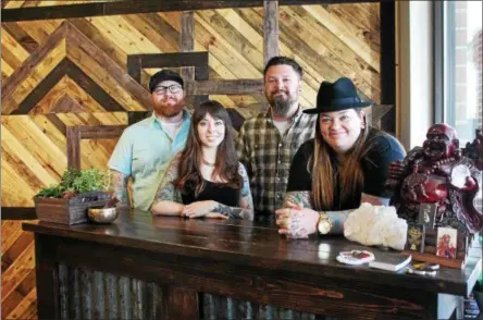  ?? LAUREN HALLIGAN — LHALLIGAN@DIGITALFIR­STMEDIA.COM ?? The tattoo artists at Parasol Tattoo Company in Saratoga Springs are, from left, Michael Ransom Backus, Abbey Saunders, Joe Wood and Joslin Gay.