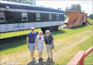  ?? SUBMITTED PHOTO/RANNIE GILLIS ?? Eleanor (Blue) Morrison, centre, is shown with Michael MacLean and Catherine Gillis. The 43-ton Russell snow plow in the background was donated to the museum by Canadian National Railways.