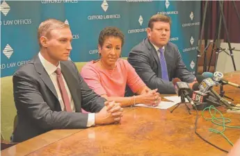  ??  ?? Amy Skinger sits with her attorneys, Charles Haskins ( left) and Bradley Cosgrove, at a press conference to discuss the $ 4.5 million judgment she was awarded.
| CLIFFORD LAW OFFICES