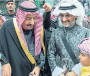  ?? /Reuters ?? Adjustment: The wealth of Prince Alwaleed bin Talal Al Saud, right, has dropped to its lowest level since 2012.