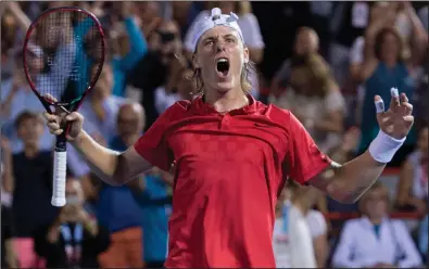  ?? CP PHOTO / PAUL CHIASSON ?? Denis Shapovalov of Canada celebrates after defeating Adrian Mannarino of France during quarter-final play at the Rogers Cup tennis tournament Friday in Montreal.