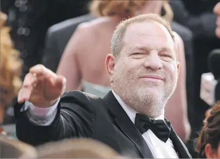  ?? Vince Bucci Invision/Associated Press ?? HARVEY WEINSTEIN, above at the 2015 Oscars, said he would take a leave of absence after the New York Times published accusation­s of sexual harassment that stretch across decades. The Weinstein Co. board is reportedly meeting Friday to discuss his fate.