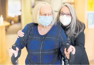  ?? RICHARD LAUTENS TORONTO STAR ?? Crystal Nikolich and her mother, Dagmar, walk through the lobby of the Post Inn Village long-term-care home, where Dagmar lives. Crystal is the essential caregiver for her mother.