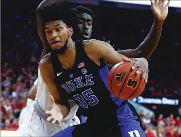  ??  ?? LEFT: Despite playing only his freshman year of college, Duke’s Marvin Bagley III showcased an array of offensive moves and figures to go in the top five during Thursday’s NBA Draft. BELOW: Oklahoma’s Trae Young has drawn comparison­s to the Warriors’...