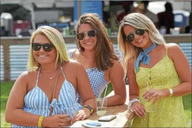  ?? PETE BANNAN – DIGITAL FIRST MEDIA ?? Brittany Travis of West Grove, Karlee Panella of Wilmington, and Emily Hayes of Hockessin, Del., enjoy the music at the Citadel Country Spirit USA Festival at Ludwig’s Corner show grounds Saturday.