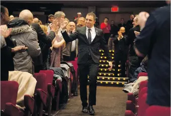  ?? DAX MELMER ?? Incoming Ward 2 Coun. Fabio Costante accepts congratula­tions after he is introduced Monday during the inaugural meeting and swearing in of the new city council at the St. Clair Centre for the Arts.