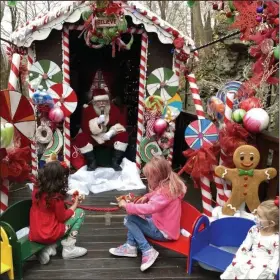  ?? COURTESY OF NATHANIAL GUEST ?? Santa Claus greets youngsters on an outside train car called Candyland as part of new restrictio­ns at the Colebrookd­ale Railroad. The train is open but has special guidelines to prevent the spread of the cornavirus.