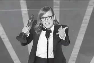  ?? KEVIN WINTER/GETTY IMAGES ?? Sarah Polley accepts the best adapted screenplay award for “Women Talking.”