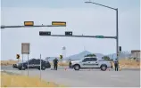  ?? MATT DAHLSEID/THE NEW MEXICAN ?? Santa Fe Police Department vehicles block off access to the parking lot of the N.M. 599 Rail Runner Express station Monday morning.