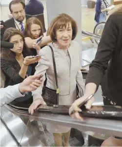  ?? AP PHOTOS ?? MOVING FORWARD: Senate Majority Leader Mitch McConnell (R-Ky.), in left photo, and Sen. Susan Collins (R-Maine), right, make their way to yesterday’s vote to advance Judge Brett Kavanaugh’s nomination to the Supreme Court.