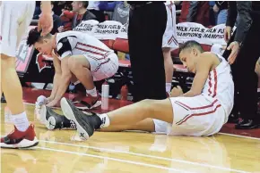  ?? WOOD/MILWAUKEE JOURNAL SENTINEL RICK ?? Sussex Hamilton's Patrick Baldwin Jr. lies on the floor after a last-second shot by the Chargers missed during Oshkosh North's 57-56 win Friday night.