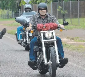  ??  ?? Mark Stringer rides to the Show and Shine motorcycle show at the Humpty Doo Hotel