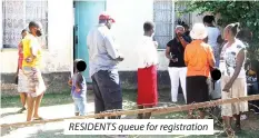  ??  ?? RESIDENTS queue for registrati­on