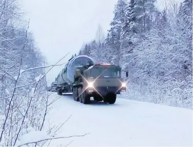  ?? RU-RTR RUSSIAN TELEVISION VIA AP ?? Russia’s new Sarmat interconti­nental ballistic missile is transporte­d in an undisclose­d location in the country on Thursday. President Vladimir Putin declared Thursday that Russia has developed a range of new nuclear weapons.