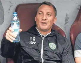  ??  ?? The Hoops boss watches from the dugout in Kazakhstan.