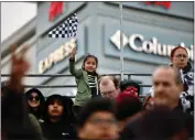  ?? PHOTO BY HOWARD FRESHMAN ?? A youngster waves a checkered flag in the grandstand during Thunder Thursday on April 13, 2023, in Long Beach.