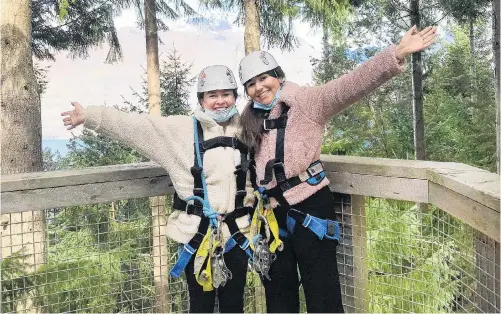  ?? PHOTOS: EMMA PERRY ?? Reporter Emma Perry (left) and friend Sofia YanezFlore­s all set to zip through the trees.