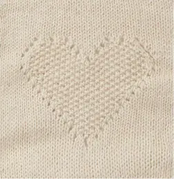  ??  ?? SQUARE 7 This pretty heart motif is worked in moss stitch and bordered by delicate eyelet stitches. Working eyelets is a gentle introducti­on to lace knitting